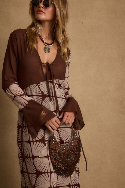 Lifestyle shot of the maxi dress styled for day-to-night versatility.