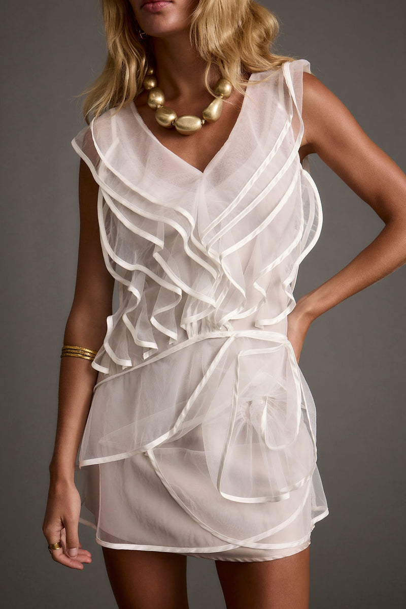 White tulle ruffled mini dress with refined accents, a white sequin dress essential.