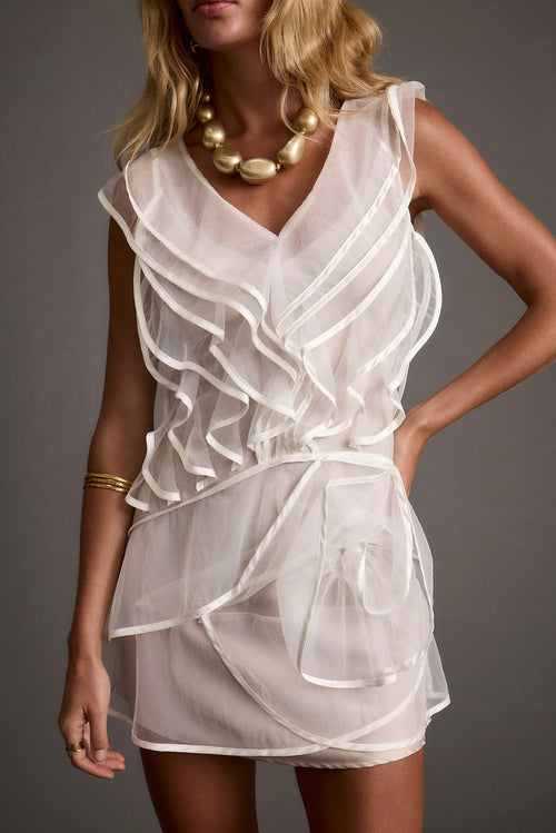 White tulle ruffled mini dress with refined accents, a white sequin dress essential.