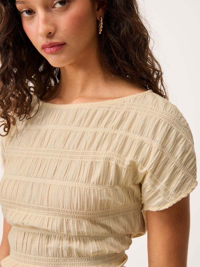 DEAN ecru smocked top worn on a model by Rouje