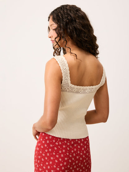 Rear view of the Tarek ecru crochet top worn by a model