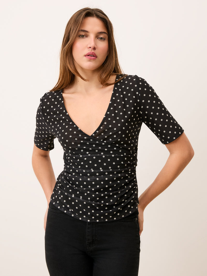 YURA black polka-dot mesh wrap effect top, front view by Rouje
