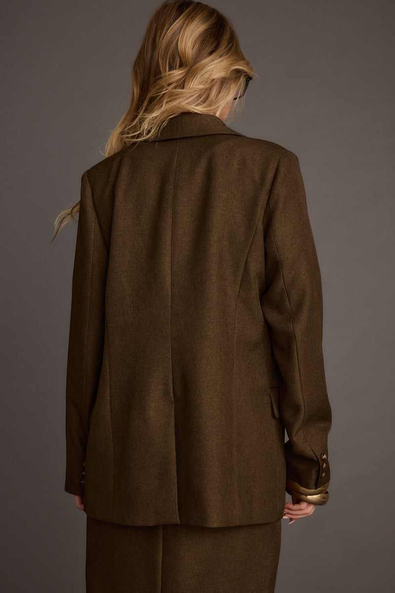 Lifestyle shot of the mocha blazer styled for day-to-night versatility.