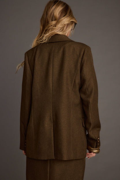 Lifestyle shot of the mocha blazer styled for day-to-night versatility.