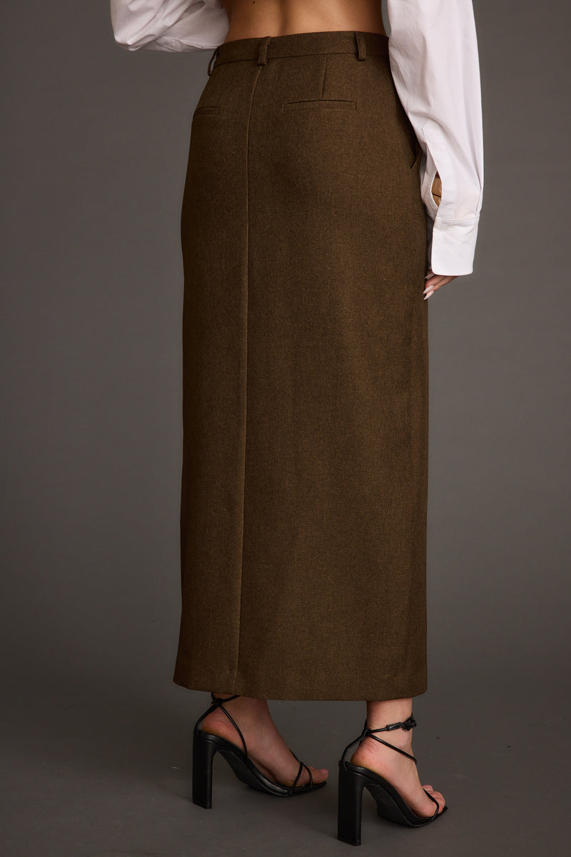 Lifestyle shot of the mocha midi skirt styled for day-to-night versatility.