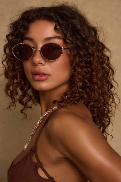 Close-up of the Verano Brown Sunglasses showcasing the fabric texture and design details.