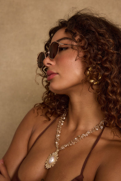 Verano Brown Sunglasses paired with complementary accessories for a polished look.