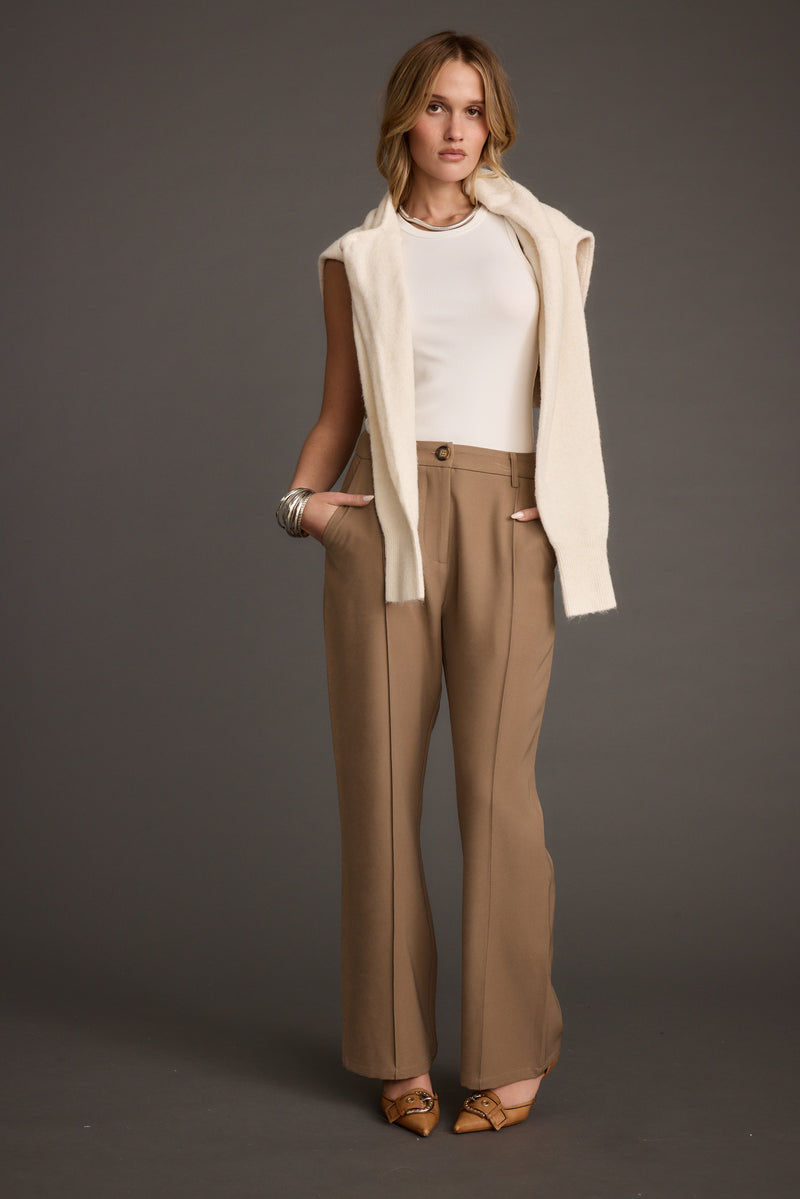 Lifestyle shot of the trousers styled for day-to-night versatility.