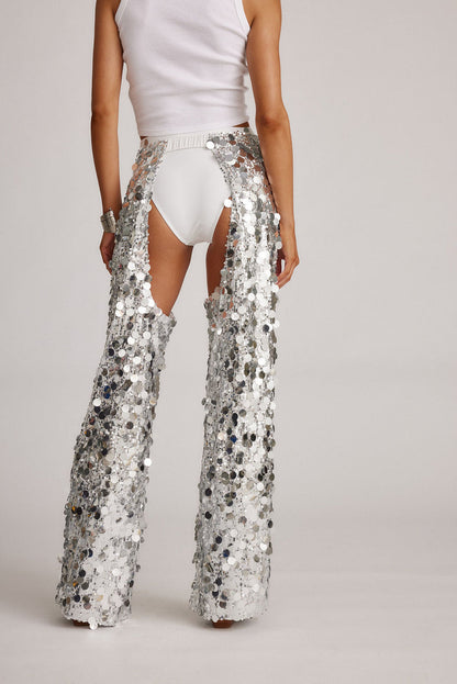 Back view of the silver pants showing the silhouette and fit.