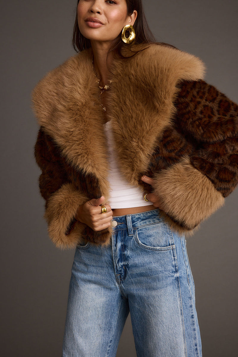 Full-length view of the leopard print jacket showing the drape and movement.