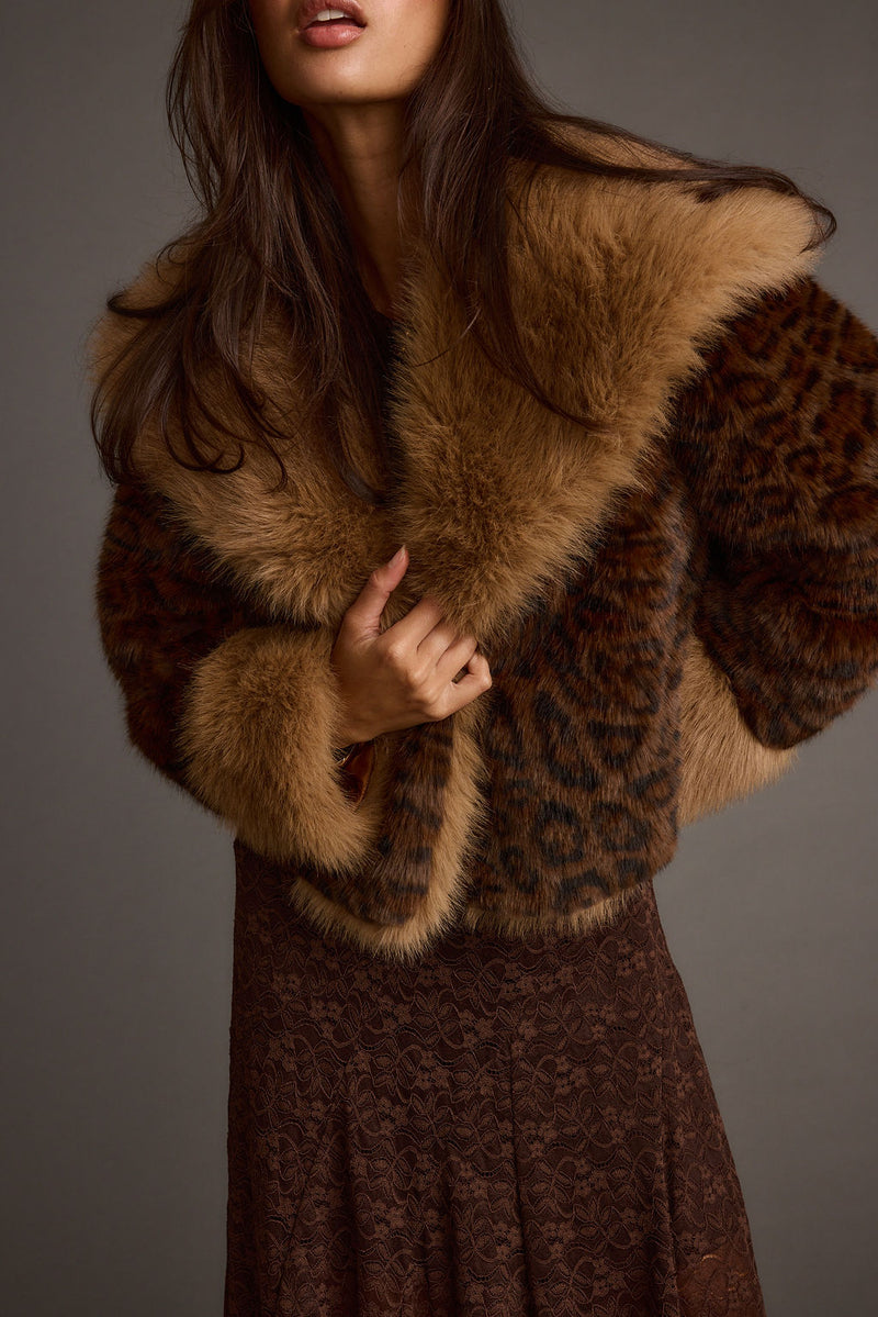 Lifestyle shot of the leopard print jacket styled for day-to-night versatility.